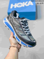 Black and gray HOKA Mafate Speed 2 sneaker with bright blue outsole accents.