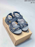 Pair of dark black ECCO open-toe sandals displayed on a shoebox, with the style code 2607JXD414A24 and size range 39-44 visible above.
