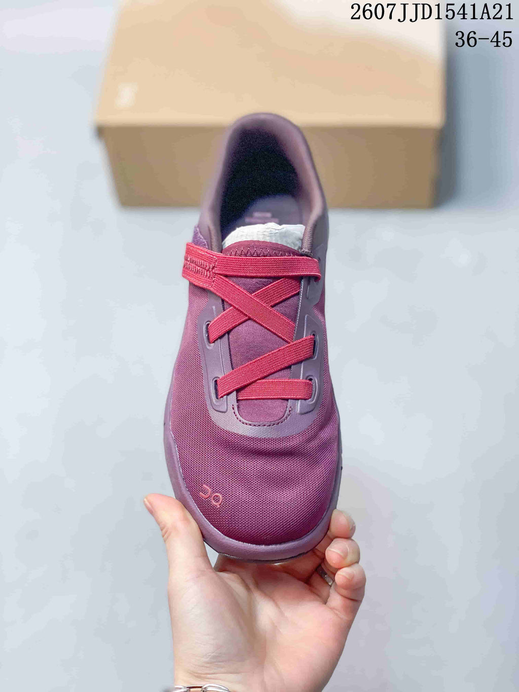 Top view of the purple and red sneaker showing the cross-lace design and adjustable strap.
