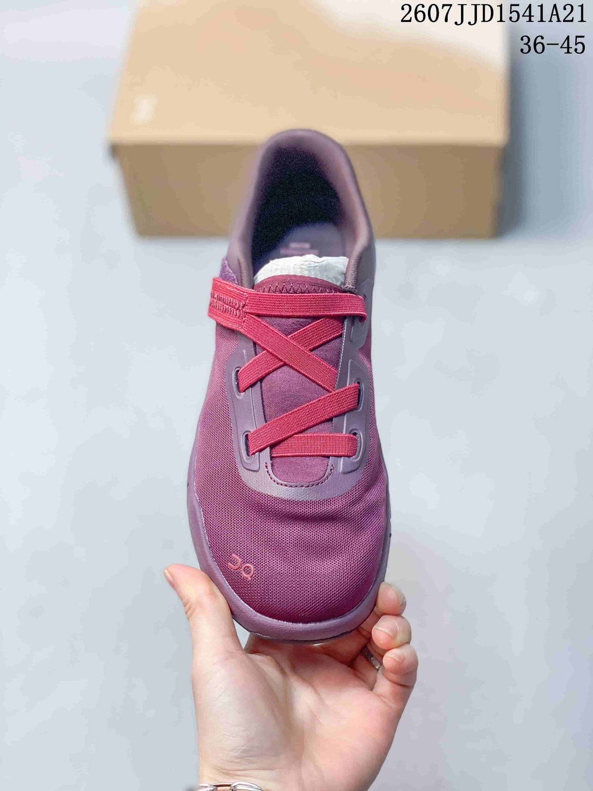 Top view of the purple and red sneaker showing the cross-lace design and adjustable strap.
