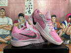 Pink basketball shoes displayed together, showing the side panels, patterned Swoosh, and graphic details.