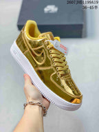 Close side view of a metallic gold sneaker with tonal laces and Swoosh branding.