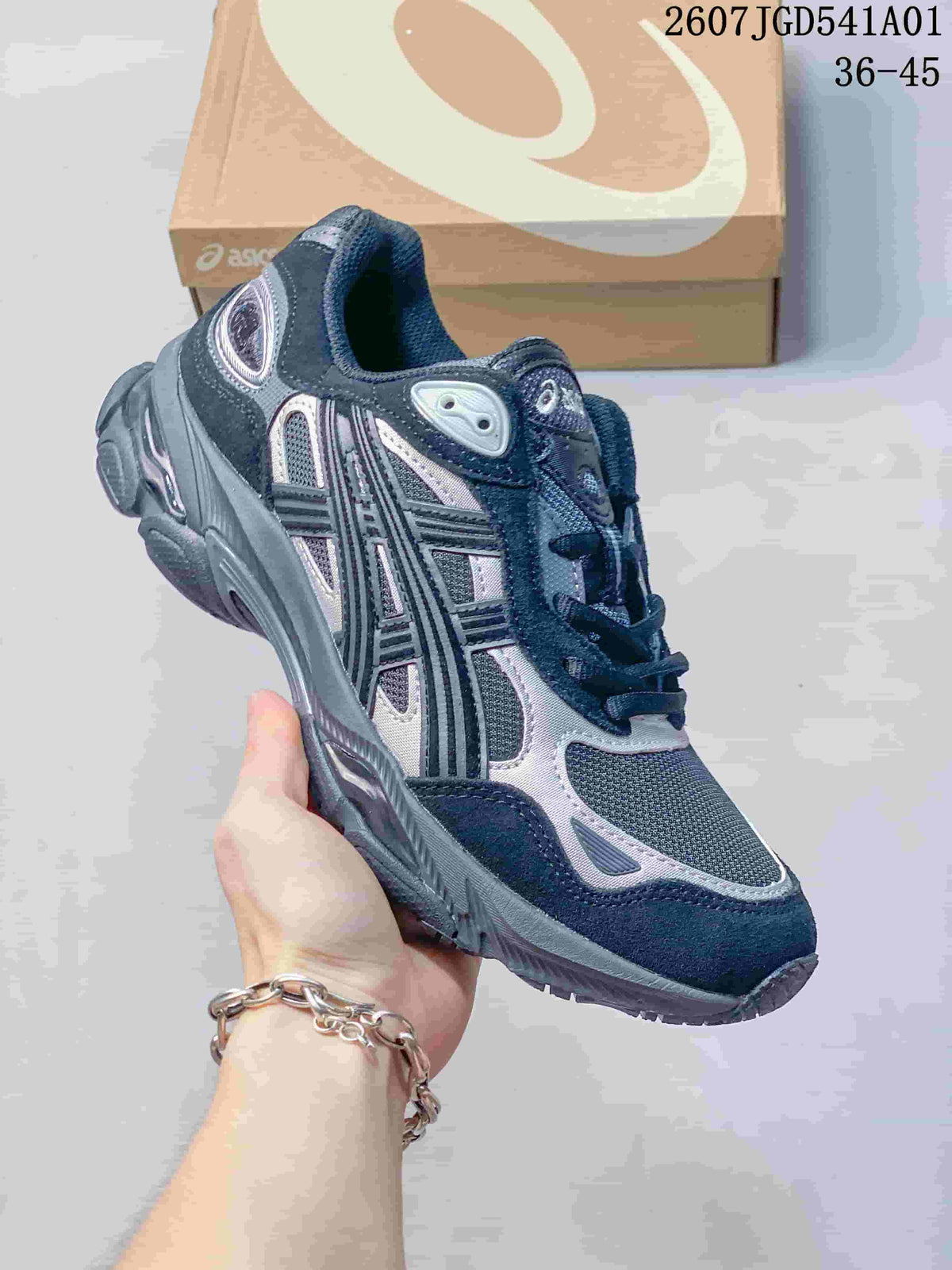 Angled side view of the navy and silver sneaker