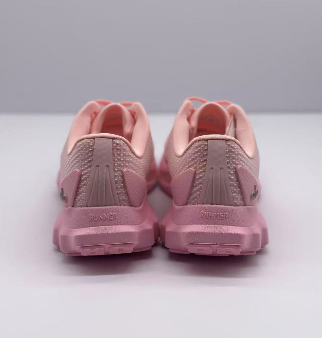 Rear view of the pink sneaker pair showing padded heel collars, heel panels, and runner text.