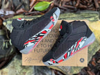 Pair of black Jordan XXXVIII basketball shoes shown from multiple angles