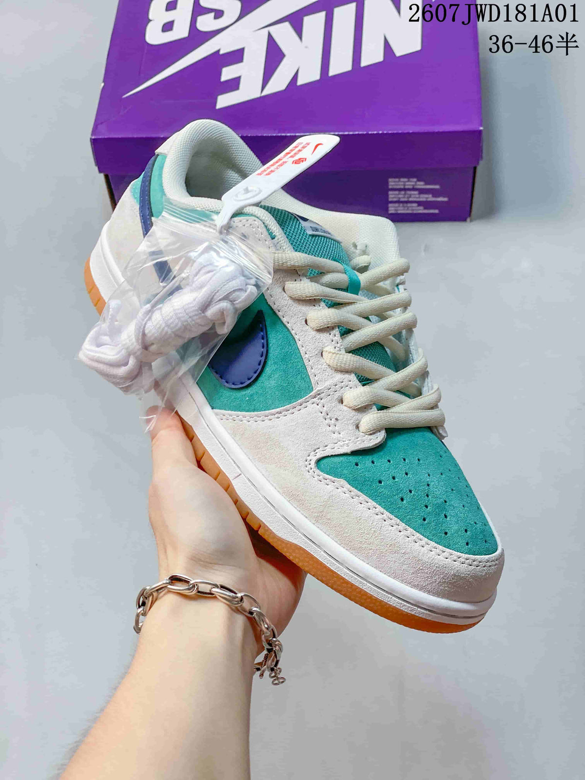 Angled view of a teal, white, and blue Nike SB Dunk Low Pro sneaker with an extra pair of white laces.
