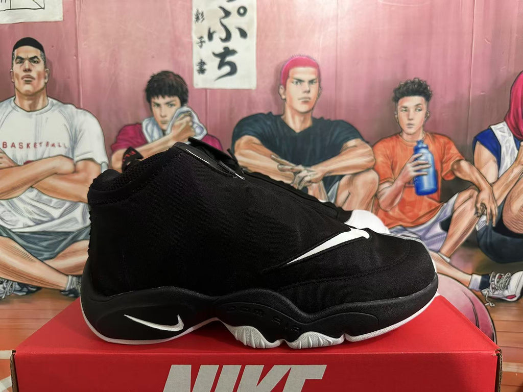 Side profile of a black high-top Nike basketball sneaker showing the white Swoosh, sculpted black midsole, and white outsole edge.
