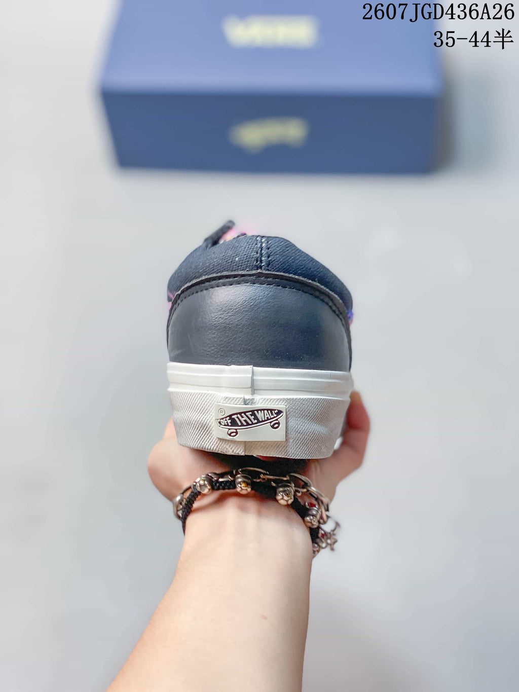 Rear view of a sneaker showing the dark navy heel and the visible Off the Wall heel label.