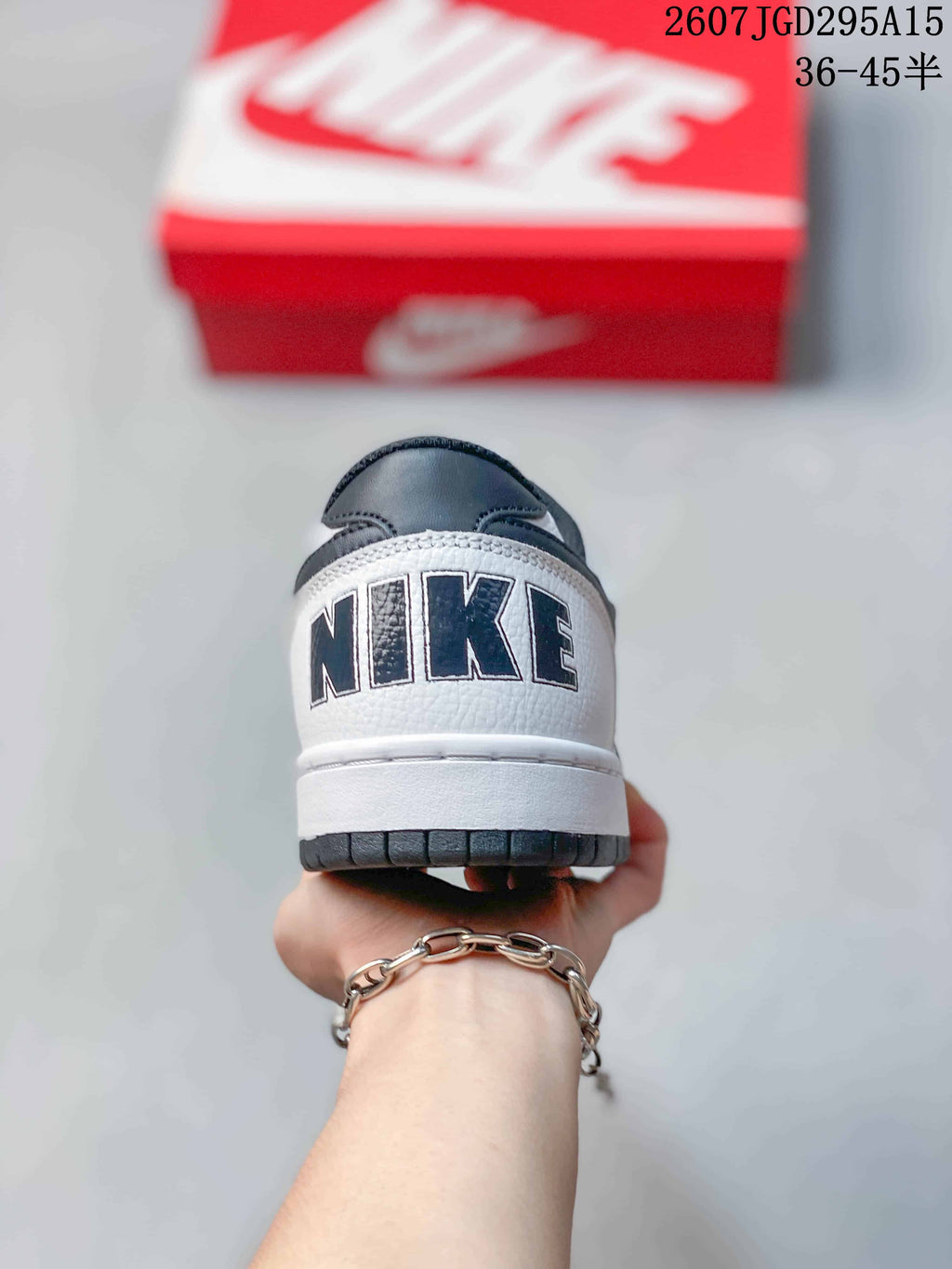 Rear view showing the white heel panel with contrasting Nike branding and dark outsole edge.