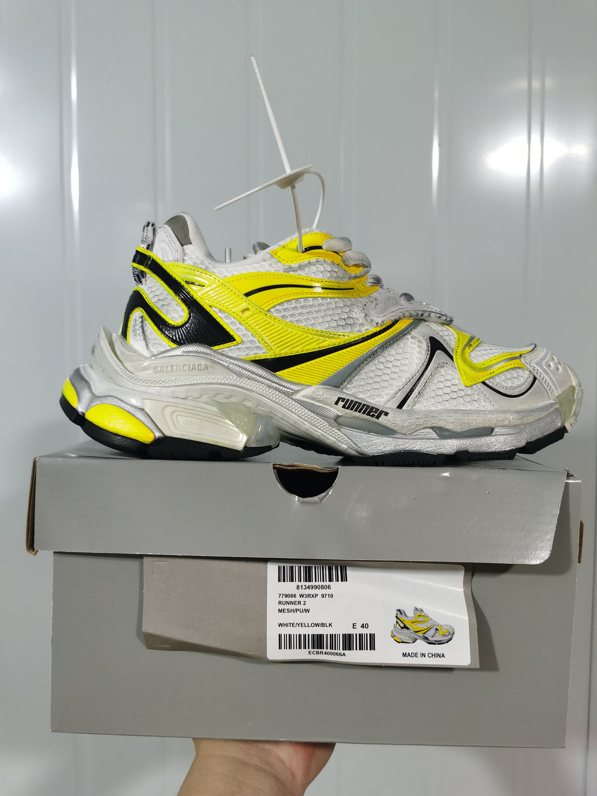 Balenciaga Runner 2 sneaker displayed on its box; the label shows color code 9710 and size E 40.
