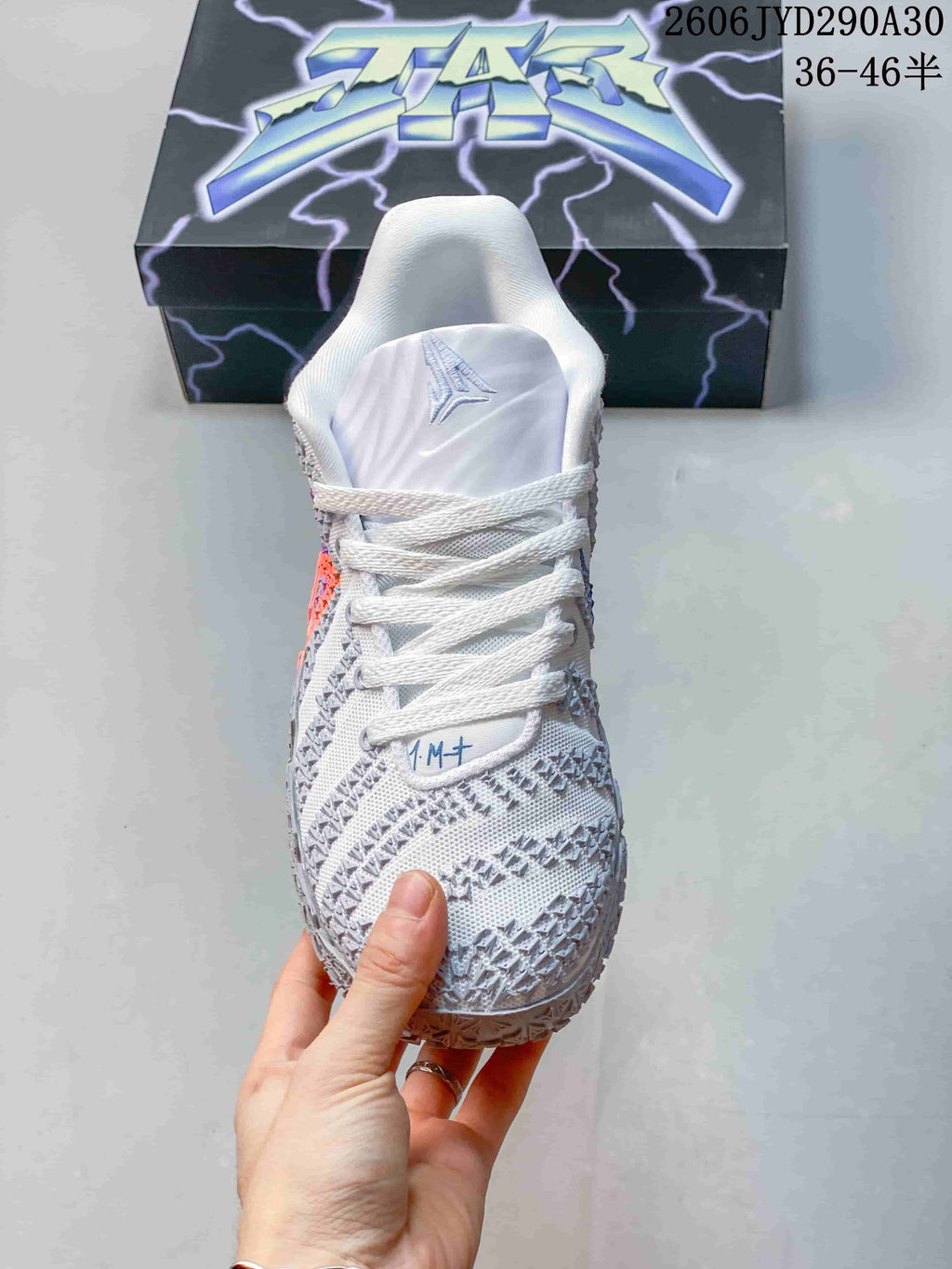 Front view showing the laces, tongue, and patterned toe.