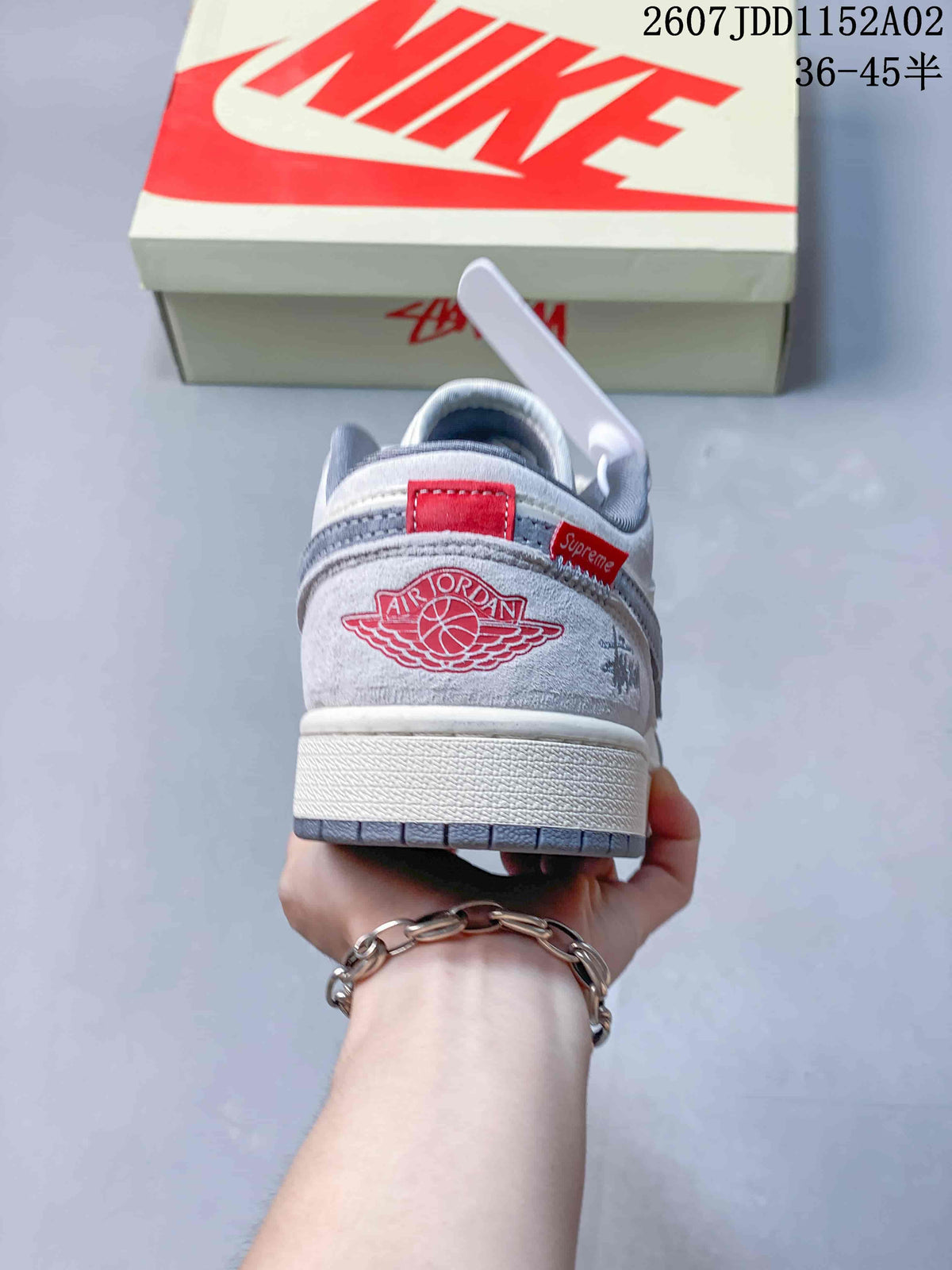 Rear view of the sneaker showing heel graphics and a red accent tab.