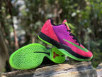 Angled view of the shoe and its bright green patterned outsole