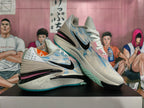 Pair of gray-blue Nike basketball shoes shown from the side and front.
