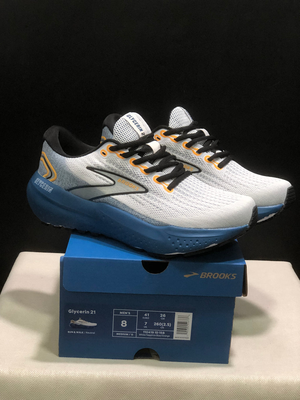 Pair of Brooks Glycerin 21 sneakers shown from a front three-quarter angle on a Brooks shoebox; the box label shows men's EU 41.