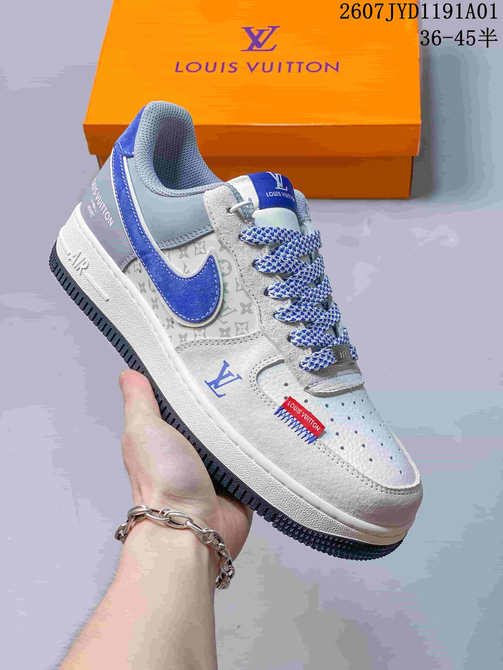 Angled side view of a blue and gray low-top sneaker with patterned panels and laces.
