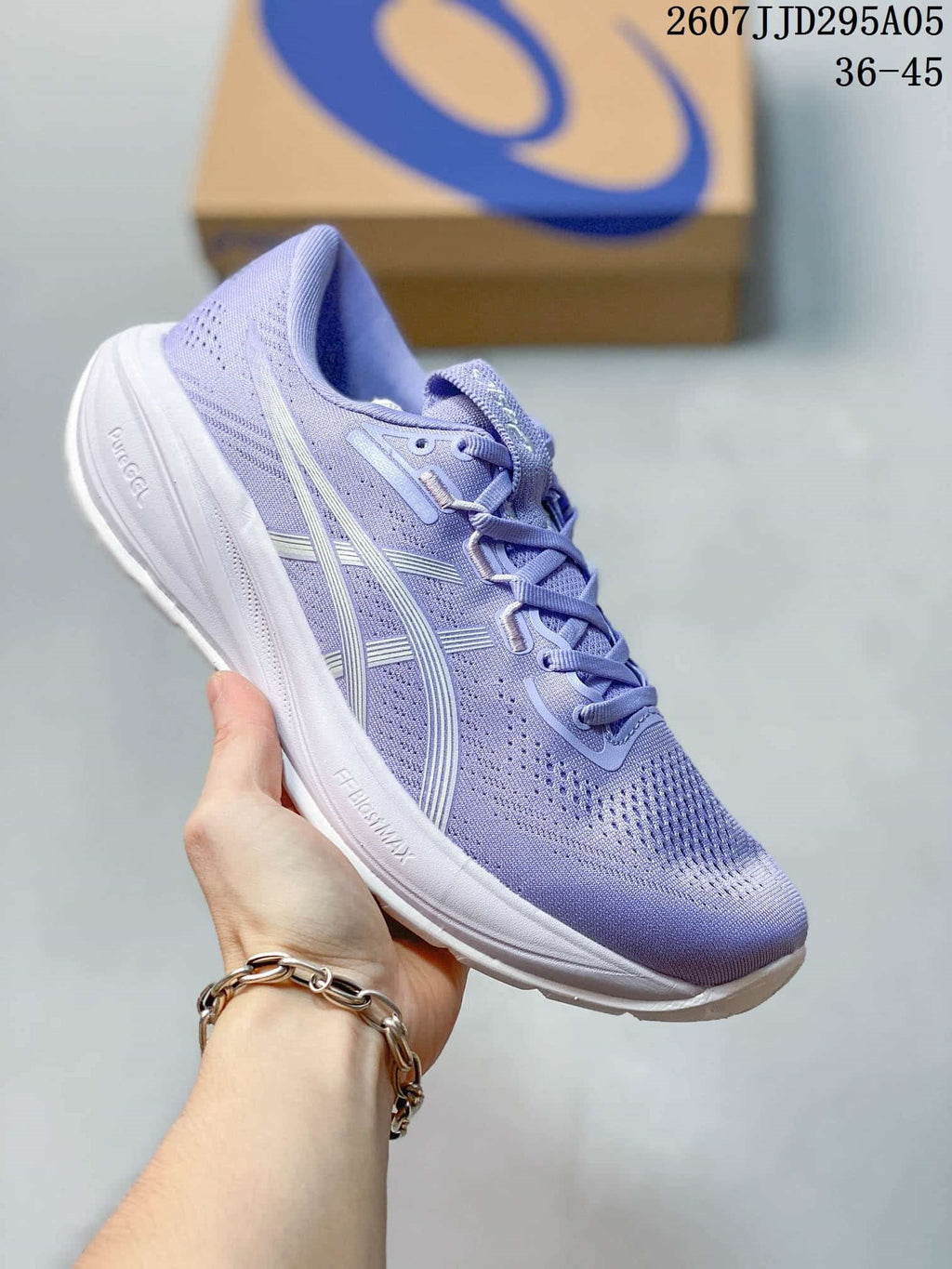 Lavender ASICS running shoe with a white midsole and visible FF BLAST+ and PureGEL markings; size range text appears at the top.