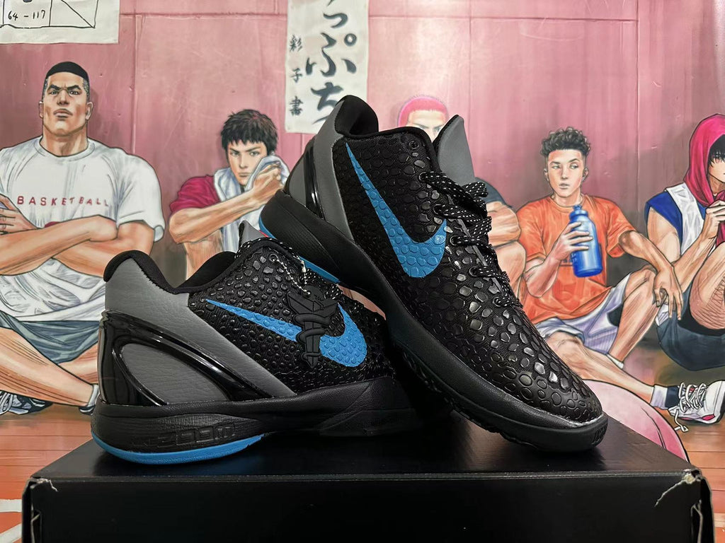 Pair of black basketball shoes with blue Swoosh accents and gray heel panels