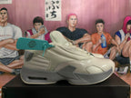 Side profile of a beige sneaker with gray accents and a visible heel cushioning window