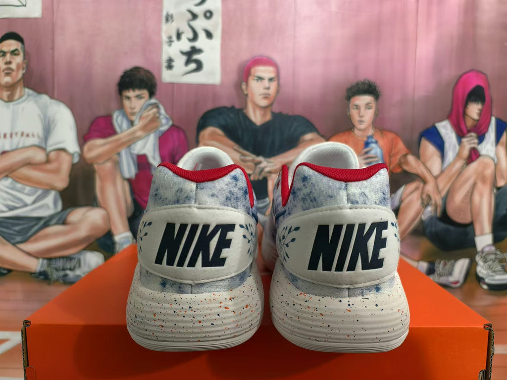 Rear view of Nike shoes showing the heel logos, mottled upper, red trim, and speckled sole.