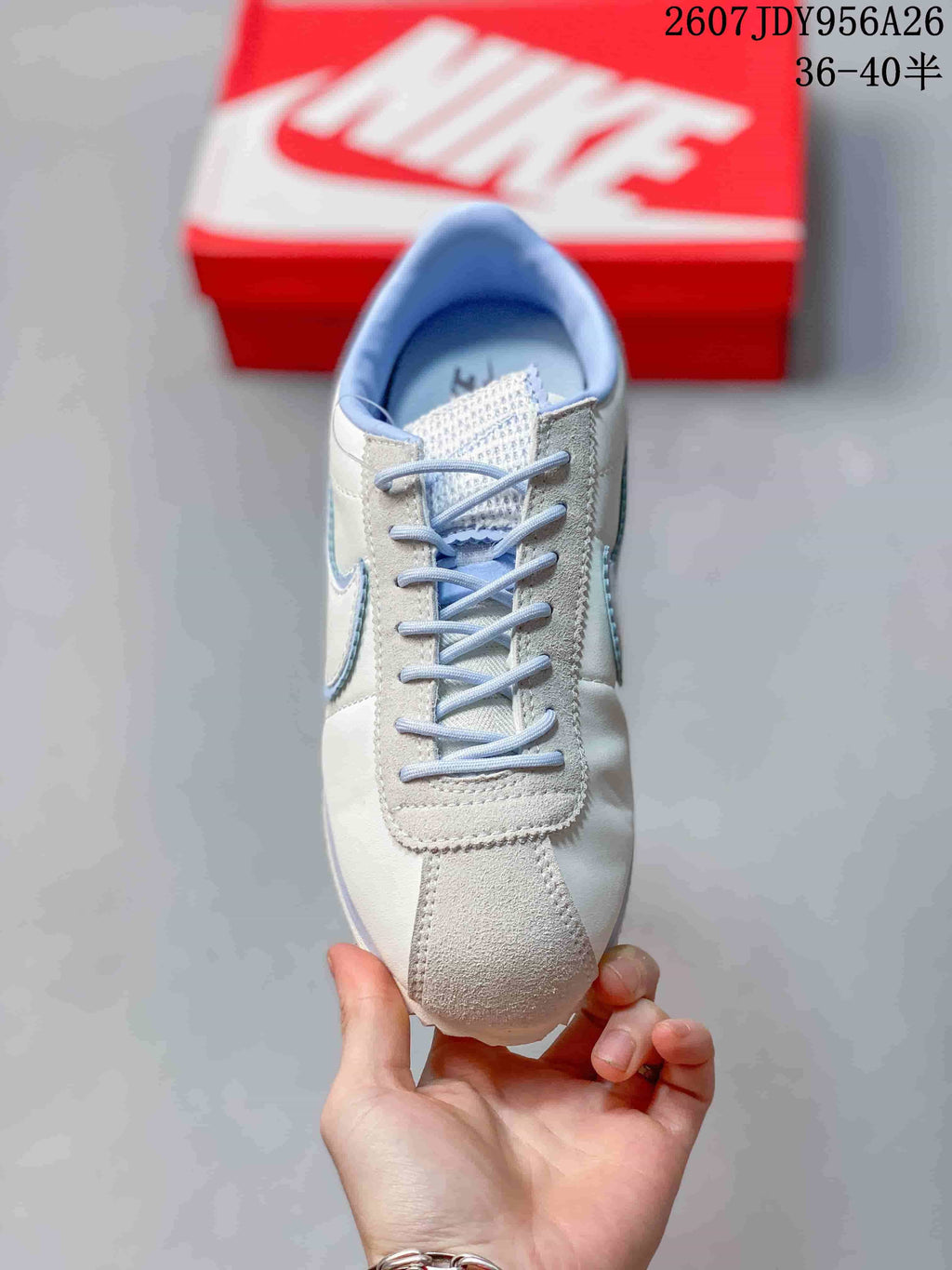 Top view showing the lace-up front, light blue laces, and suede-look toe panel.