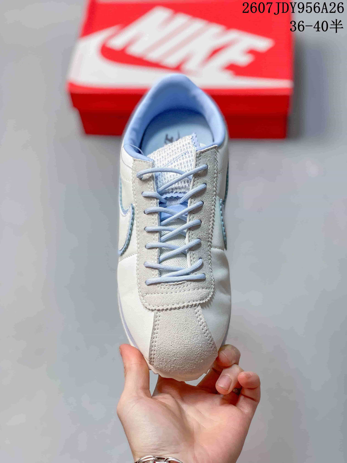 Top view showing the lace-up front, light blue laces, and suede-look toe panel.