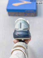Rear view of the running shoe showing the padded heel collar and dark navy heel section.