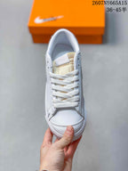Top view showing the white laces, tongue, perforated side panels and toe box.