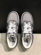 Top-down view showing perforated toe panels, white laces, and branded insoles.