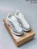 White and silver ASICS Gel-Kayano 14 sneakers displayed on an ASICS shoebox; image text shows style code 2607JXD676A26 and size range 36–45.