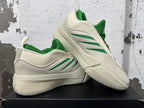 Cream and green Dame 9 shoes displayed together
