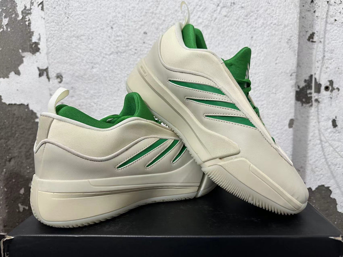 Cream and green Dame 9 shoes displayed together