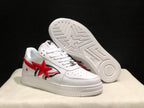 Angled view of the sneakers showing the red star side graphics and the patterned outsole with a large star motif.