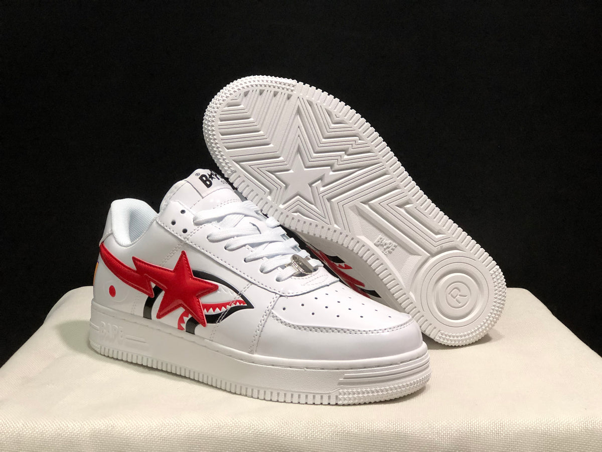 Angled view of the sneakers showing the red star side graphics and the patterned outsole with a large star motif.