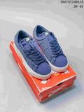 Pair of blue Nike Blazer Low sneakers displayed on a red Nike shoebox; image text shows style code 2607NY246A16 and size range 36–45.
