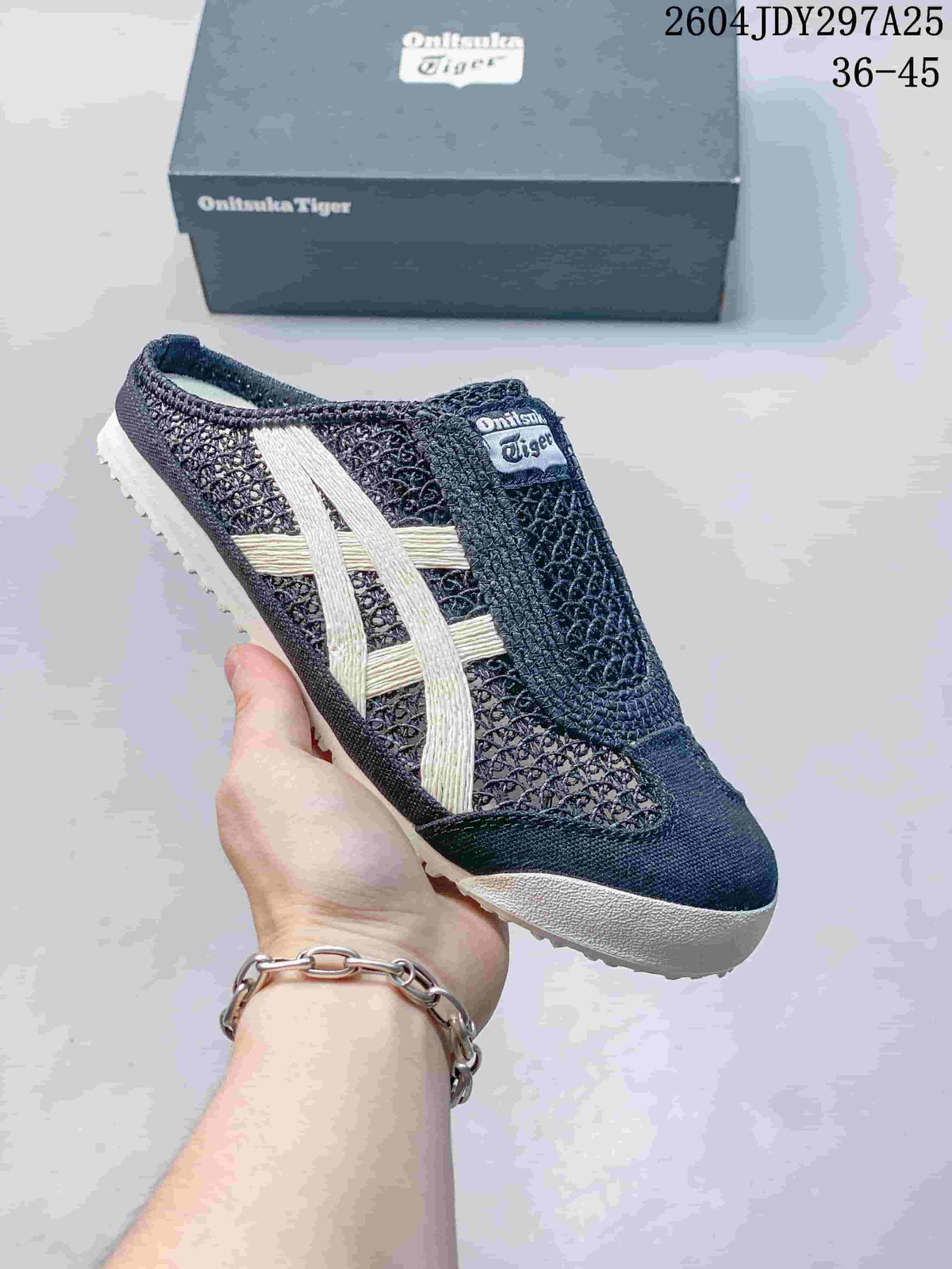Black and white Onitsuka Tiger Mexico 66 Sabot sneaker held in hand with its box behind it; the image shows style code 2604JDY297A25 and size range 36–45.
