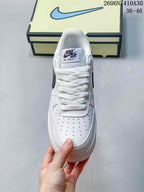 Front view showing the perforated toe box, white laces, and tongue label