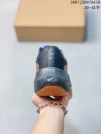 Rear view of the shoe showing the dark heel counter, small Nike logo and textured outsole.