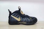 Side view highlighting the metallic gold Swoosh and patterned midsole detail