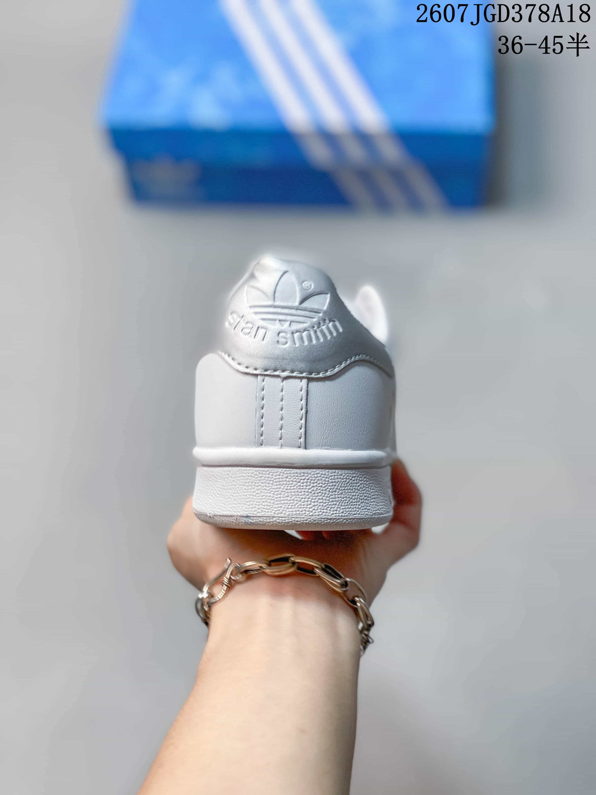 Rear view showing the Stan Smith heel branding and stitched heel detail.