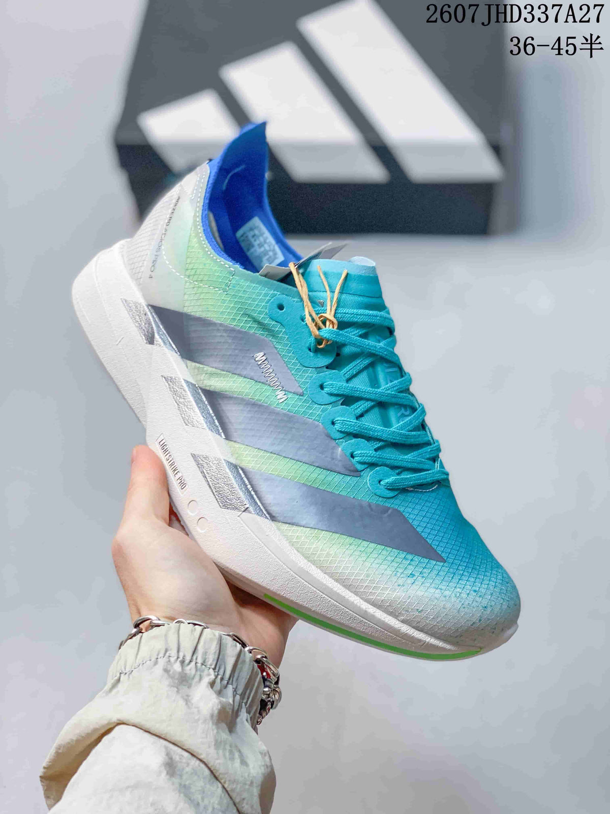 Angled side view of the aqua and white sneaker showing the low-top shape, lacing, side stripes, and white outsole.