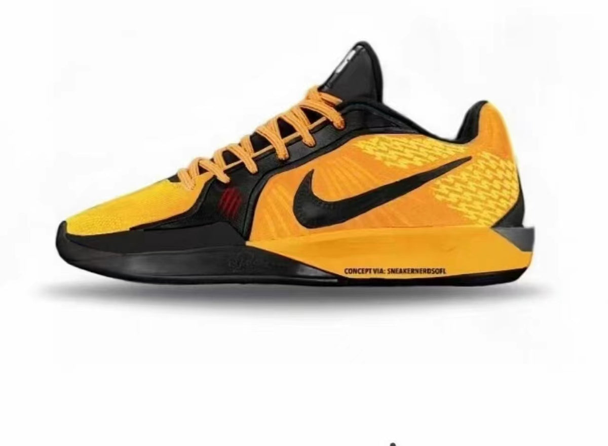 Yellow and black low-cut Nike basketball shoe with a black Swoosh and contrasting laces