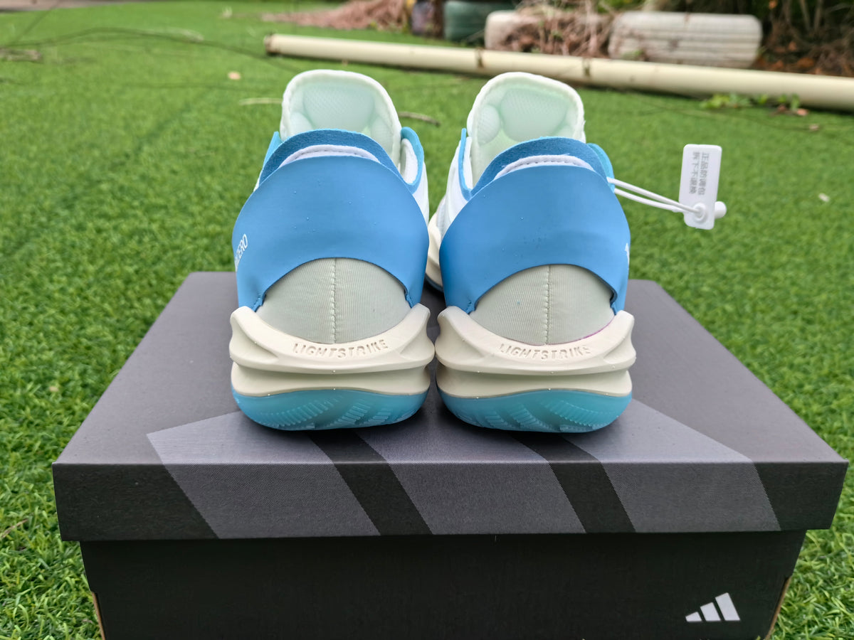 Rear view of the Adidas Adizero shoes showing blue heel panels and sculpted midsoles.