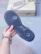 Dark navy rubber outsole of the sneaker showing concentric circular tread sections.