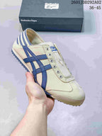 Cream Onitsuka Tiger slip-on sneaker with navy blue side stripes