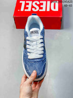 Top view of a blue denim-look lace-up sneaker with a branded tongue label.
