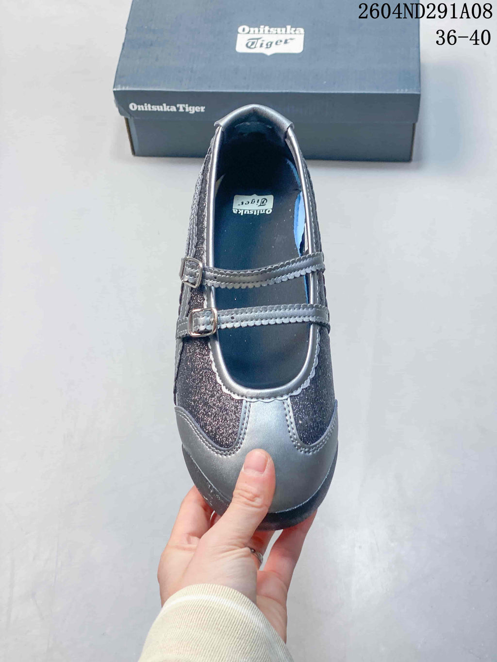 Top view showing the rounded toe, two buckle straps, gray trim, and dark glittered panels.