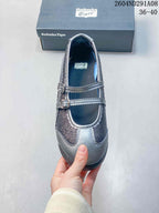 Top view showing the rounded toe, two buckle straps, gray trim, and dark glittered panels.