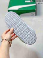 Close view of the light gray outsole showing its repeating geometric tread pattern; the image shows size range 36-45.