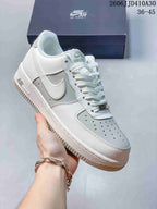 Close view of a white Nike Air Force 1 '07 Low sneaker with light neutral accents